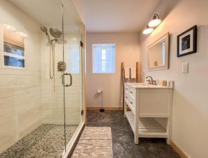 a bathroom with a shower and a sink at White Mountain Dream Cabin in Fryeburg +92 photos