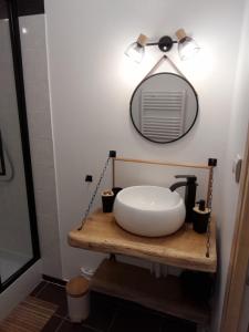 a bathroom with a sink and a mirror at Studio pistes La Bresse Hohneck in La Bresse +8 photos