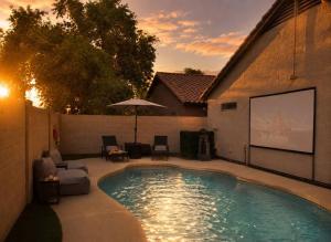 a swimming pool in the backyard of a house at Desert Disconnect Outdoor Cinema and Pool in Mesa