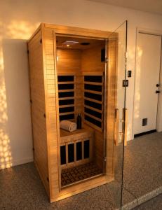 a walk in closet with a glass door at Desert Disconnect Outdoor Cinema and Pool in Mesa +15 photos
