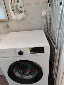 a washer and dryer in a small room at Apartment Kanali The best view in Kanali