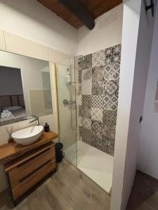 a bathroom with a sink and a glass shower at Casa Simon in Lanciano
