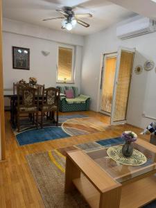 a living room with a table and a dining room at Sofi Central Apartment in Ohrid