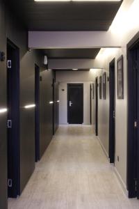 a corridor of a building with a hallway at Stream Suites Pinamar in Ostende