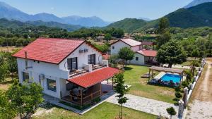 an aerial view of a house with a swimming pool at Guest House MICAJ in Himare