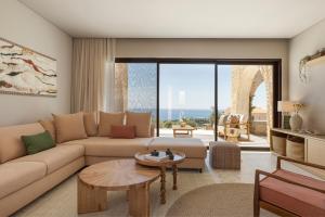 a living room with a couch and a table at Kerami Kefalonia in Kefallonia