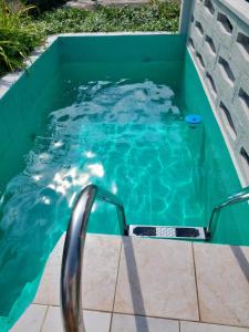 a swimming pool with a swimming pool slide in the water at Ferienhaus Auszeit in Höchstädt an der Donau