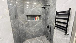 a bathroom with a shower with a ladder in it at Modern Villa in Quba City Center in Quba +32 photos