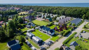 an aerial view of a small town with a park at Domki u Basi - 250m do Plaży - Idealne dla Rodzin in Karwia