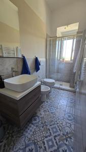 a bathroom with a tub and a toilet and a shower at Casina Da Vinci in Vinci +8 photos