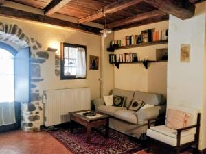 a living room with a couch and a table at CASALE SPOLETO in Spoleto