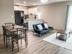 a living room with a table and chairs and a kitchen at Charming 1BR Getaway - Private, Pet Friendly, TV in Texas City