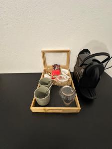 a tray with bowls and other items on a table at Pelion Roots in Zagora