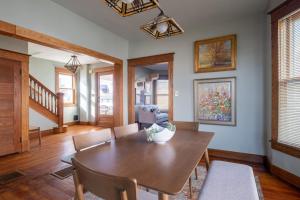 a dining room with a wooden table and chairs at Robin's Egg, Private Downtown, Pet-Friendly Gem in Columbus