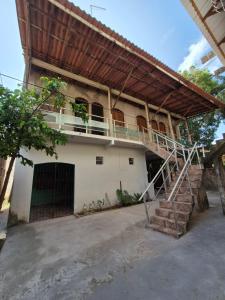 a building with a staircase in front of it at Casa da Tia in Salvaterra