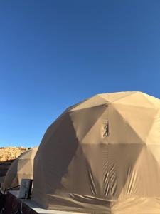 two tents are set up in the desert at Rehana rum luxury camp in Wadi Rum