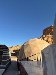 two domes on top of a building in the desert at Rehana rum luxury camp in Wadi Rum