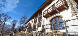 a building being constructed with windows on the side at Country Cottage by LePigne World in Ameno +88 photos