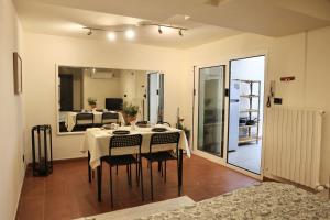 a dining room with a table and some chairs at B&B Camilla in Rimini +3 photos