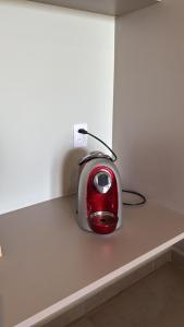 a toaster sitting on top of a counter at Apartamento 313 Bobz Concept in Cajueiro