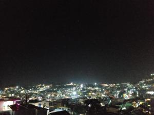 a view of a city lit up at night at Mithra Cottages individual Villa in Ooty