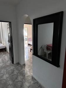 a mirror on the side of a wall in a room at Zarzis 1 in Zarzis