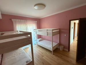 a bedroom with two bunk beds and a window at Capsule Marisol Family Retreat in Corroios +109 photos