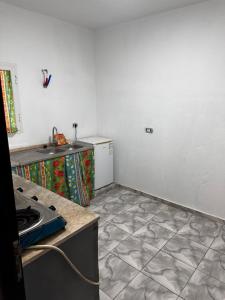 a kitchen with a sink and a counter top at Zarzis 1 in Zarzis