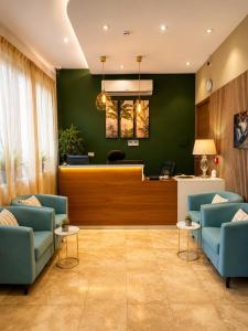 a waiting room with two blue chairs and a waiting station at Tritoni Valletta Boutique Hotel in Il-Furjana +58 photos