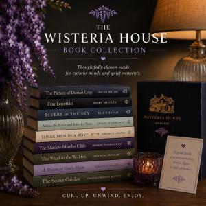 a stack of books sitting on a table with a lamp at Wisteria House Boutique Stay Marlow in Marlow