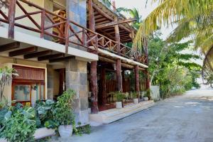 a building with plants on the side of it at Chuk-Kay by ÓOL Hotels in Holbox Island