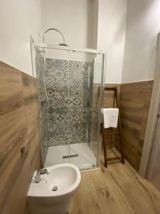 a bathroom with a shower and a sink at Domu hermosa in Villaputzu
