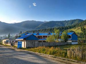 a group of buildings on the side of a road at Blue Bird Resort Utror Swat in Utrot