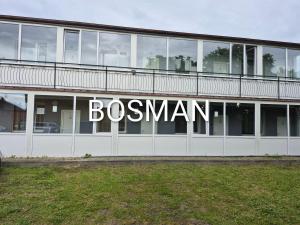 a building with a sign that reads bosemen at Bursztyn in Władysławowo