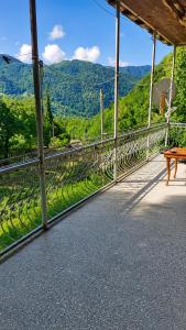 a balcony with a bench and a view of the mountains at Utsera Veranda in Utsera