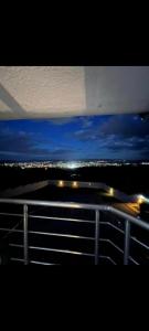 a view of a highway at night with lights at Panorama View in Niš