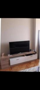 a flat screen tv sitting on top of a table at Panorama View in Niš