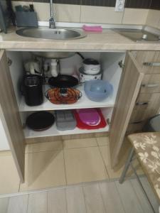 a kitchen cabinet with a sink under a counter at Vea in Banja Koviljača +36 photos