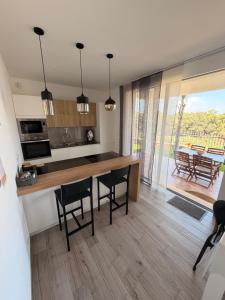 a kitchen with a table and chairs in a room at Villa Marina Luxury in Balestrate
