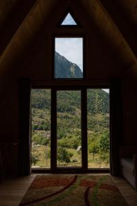 a window in a room with a view of a mountain at Andi's Home in Bogë