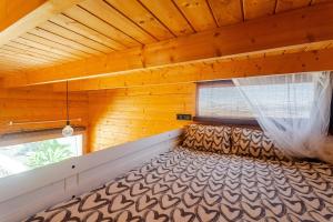 a large bed in a room with a window at Aloha Studio in La Oliva +38 photos