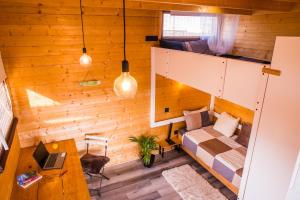 an overhead view of a room with a bed and a couch at Aloha Studio in La Oliva