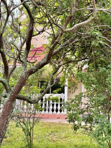 a white fence in front of a house at Remizovka Mount in Almaty +7 photos