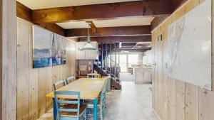 a dining room with a wooden table and chairs at White Sands Village 27 in Ocean City