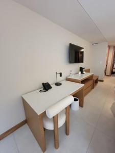 a room with a white table and a sink at Hotel Alameda in Tegucigalpa