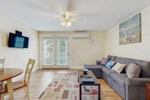 a living room with a couch and a table at New Condo w/Water-View Deck in Edgecomb in Edgecomb