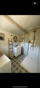a bathroom with a shower and a sink and a ladder at Villa la Roma in Aix-en-Provence