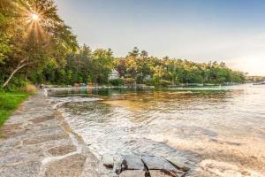 a body of water with trees and a shoreline at Amazing All-Season Sprucewold Cabin w/ Private Beach Club Access Dog-friendly in Boothbay Harbor