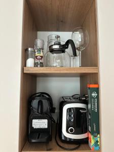 a cupboard with a toaster and a toaster at Apartment 225 in Forstau +9 photos