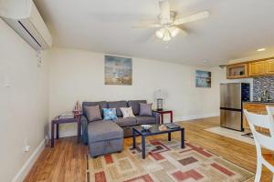a living room with a couch and a table at New Condo w/Water-View Deck in Edgecomb in Edgecomb